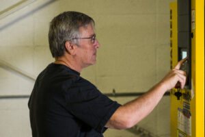 Jt Westcott working with a CNC machine.