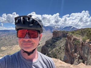 A selfie of Janis with mountains in the background