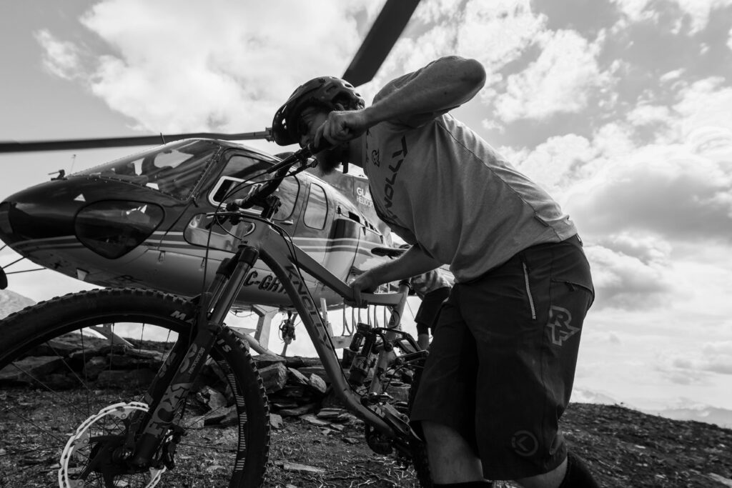 Eric and his bike with helicopter in the background