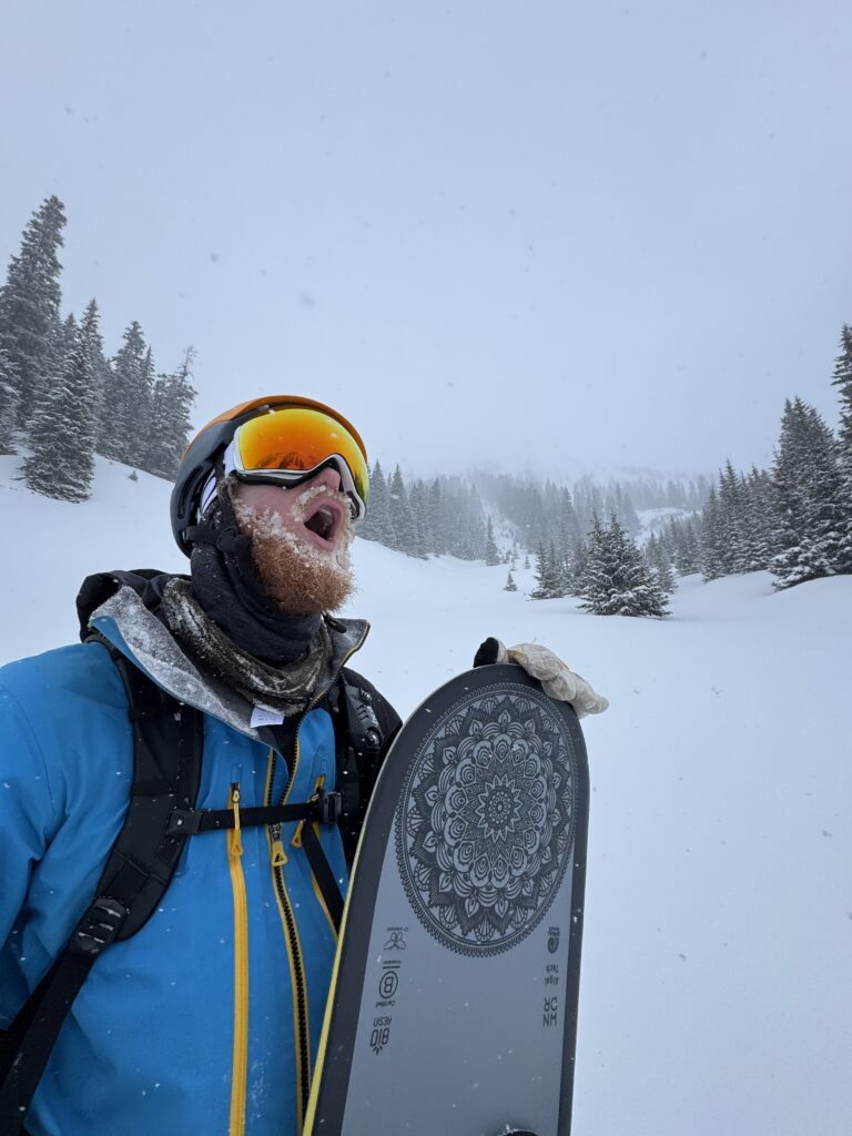 Eric rejoicing on a ski hill