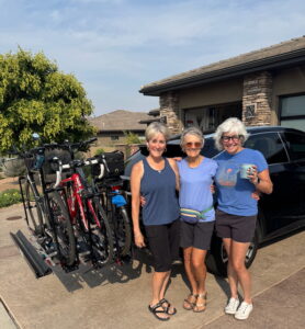 Noni with tri friends and bikes on the rack